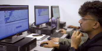 Students working on a computer in a lab