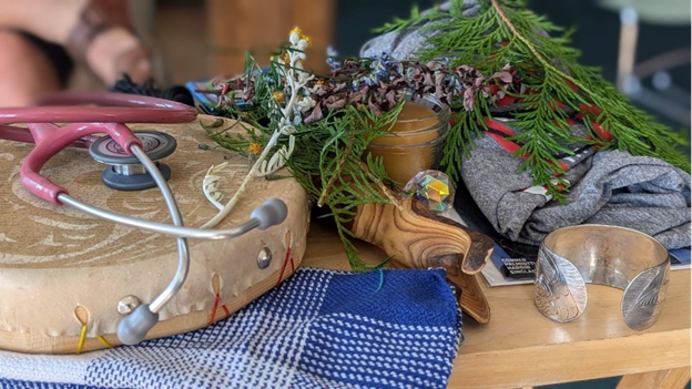 A table with a stethoscope and plants