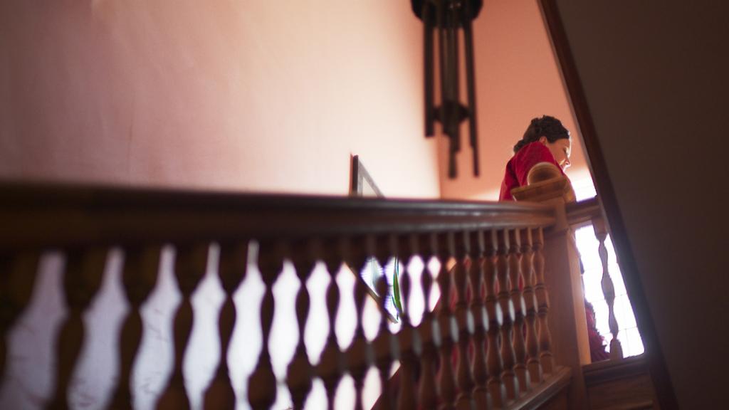 A woman walking up the stairs.