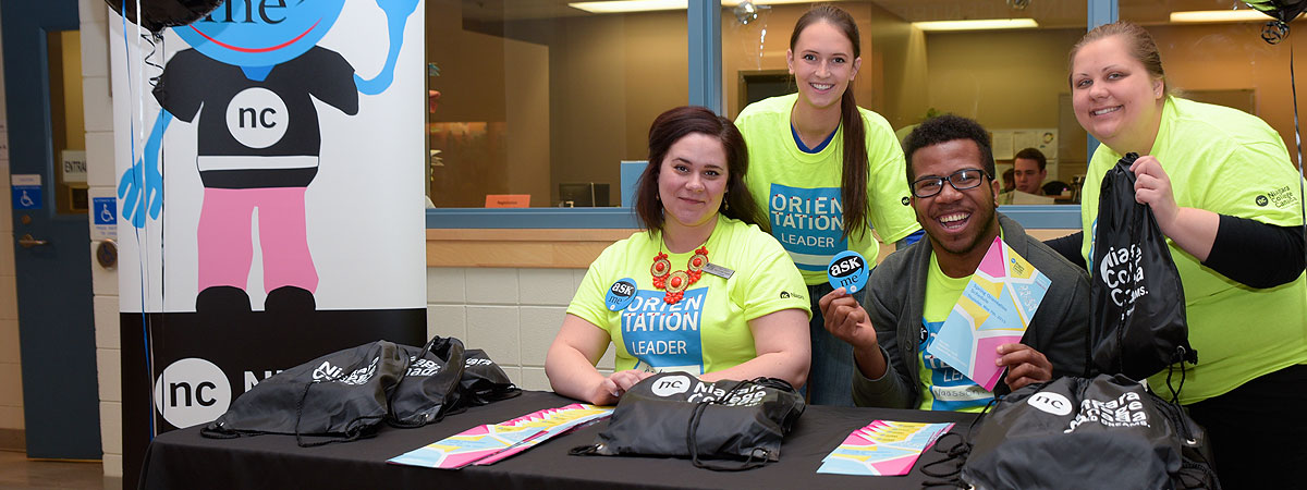 Group of student Orientation volunteers at a help desk