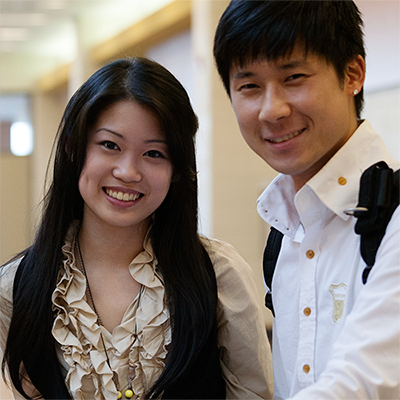 Two Chinese students smiling