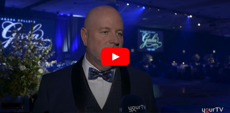 President Kennedy in a tux speaks during YourTV interview