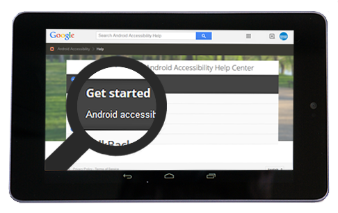 An Android tablet displaying a magnifying glass to make text larger