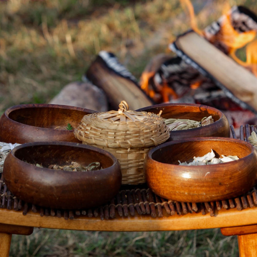 Wooden bowls containing sacred plants and herbs