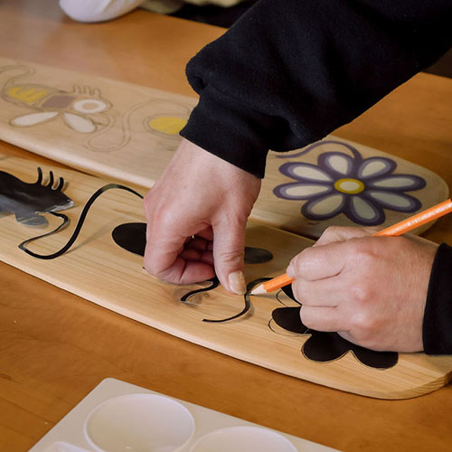 Drawing on a paddle.