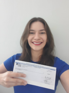 International student Caroline Gullich Cruz accepts her award