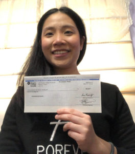 International student Somluk Sukchuenrutai with her award