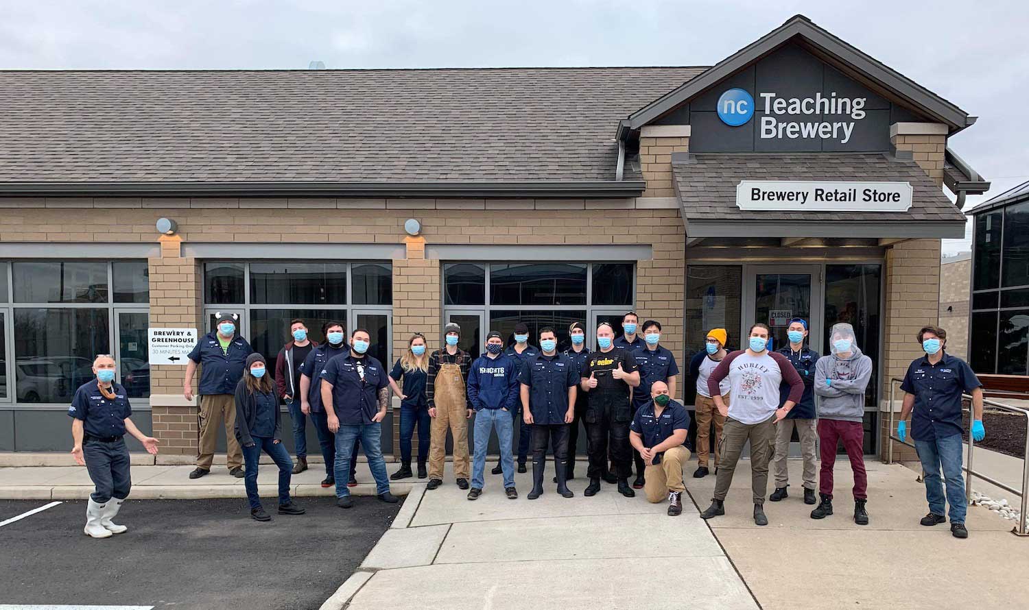 Brewmaster and Brewery Operations students stand outside the Niagara College Teaching Brewery
