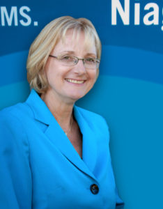 Janet Allan headshot against Niagara Collge logo