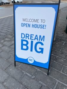 an A-frame sign reads Welcome to Open House! Dream Big