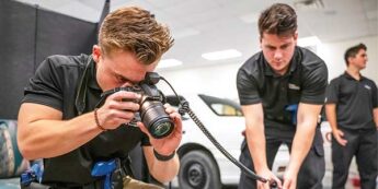 Advanced Law Enforcement and Investigation students taking photos of a simulated scene.