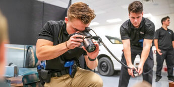 students taking photos of a simulated scene.