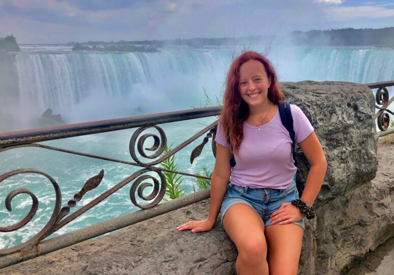 Kristen Hoekstra sitting with Niagara Falls in background