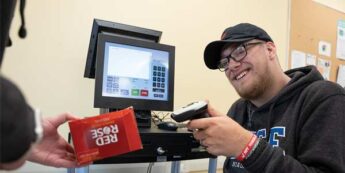 Student using a cashier simulation in a college classroom.