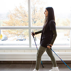 Student with walking sticks