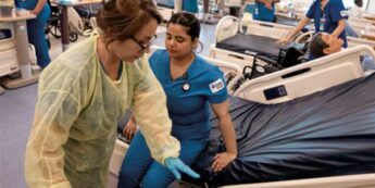 Two healthcare students work in a medical facility