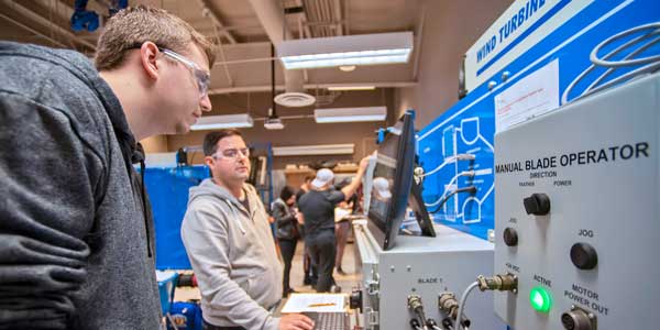 Student looking at machine