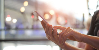 Woman searches on her phone