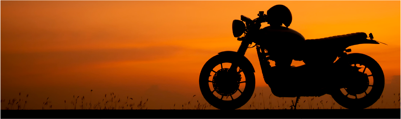 Header image of motorcycle with sunset in background