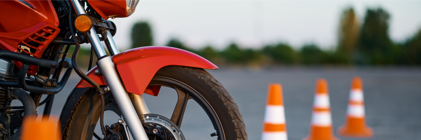 Close Up Image of Motorcycle with Training Pilons in Background
