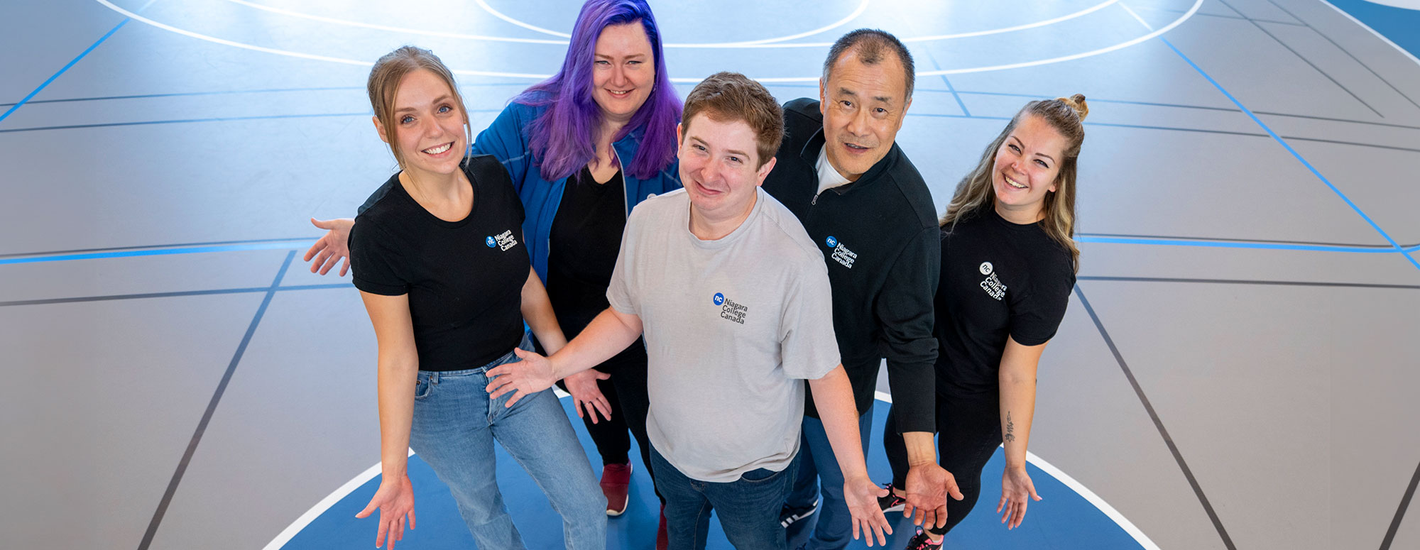 Five Recruitment Team members posing welcomingly