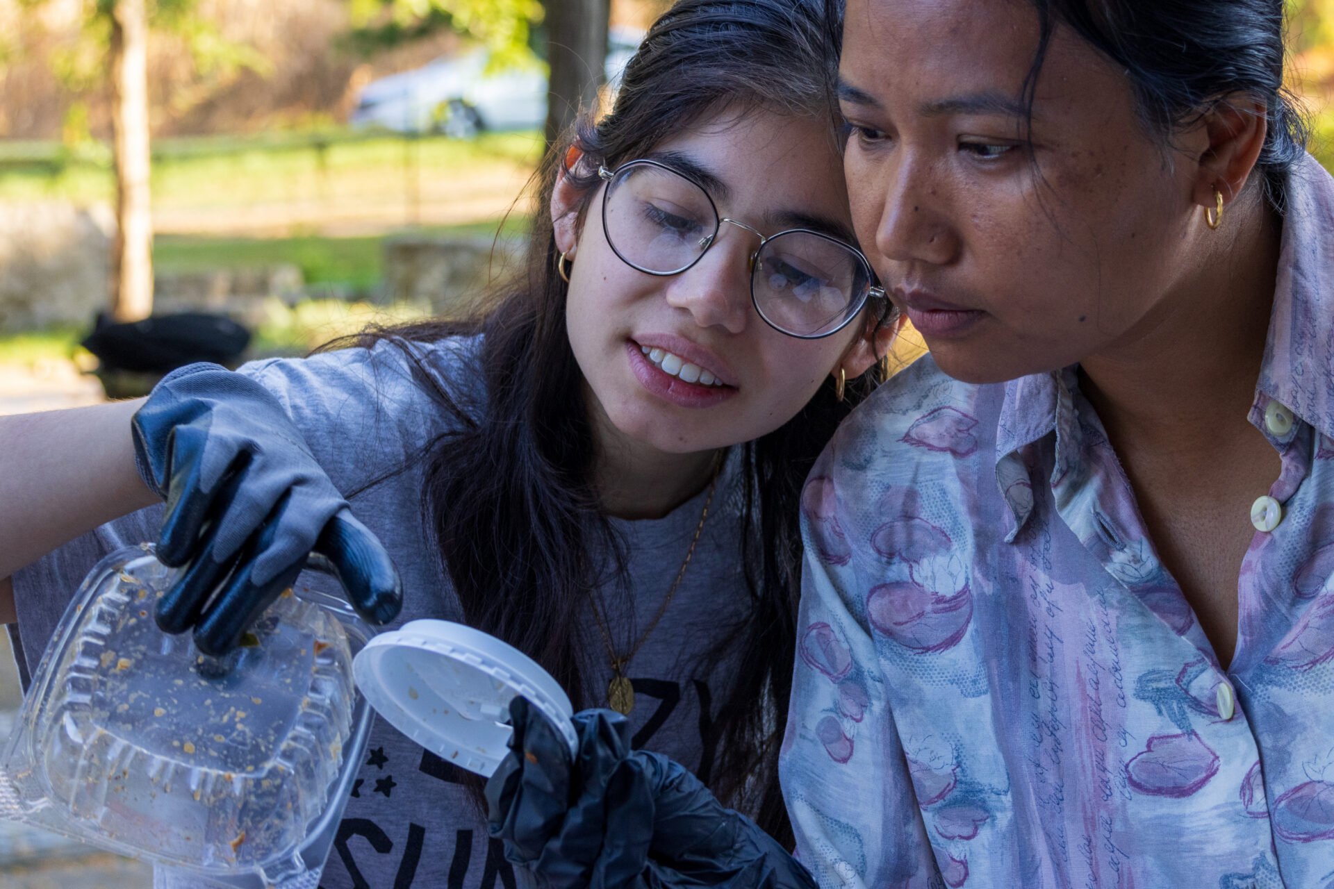 students looking at the lid of a coffee cup