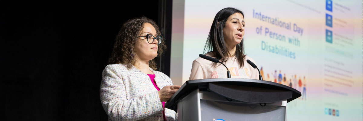 Nadeen and Samah speak on stage