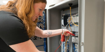 Student working with electrical connections