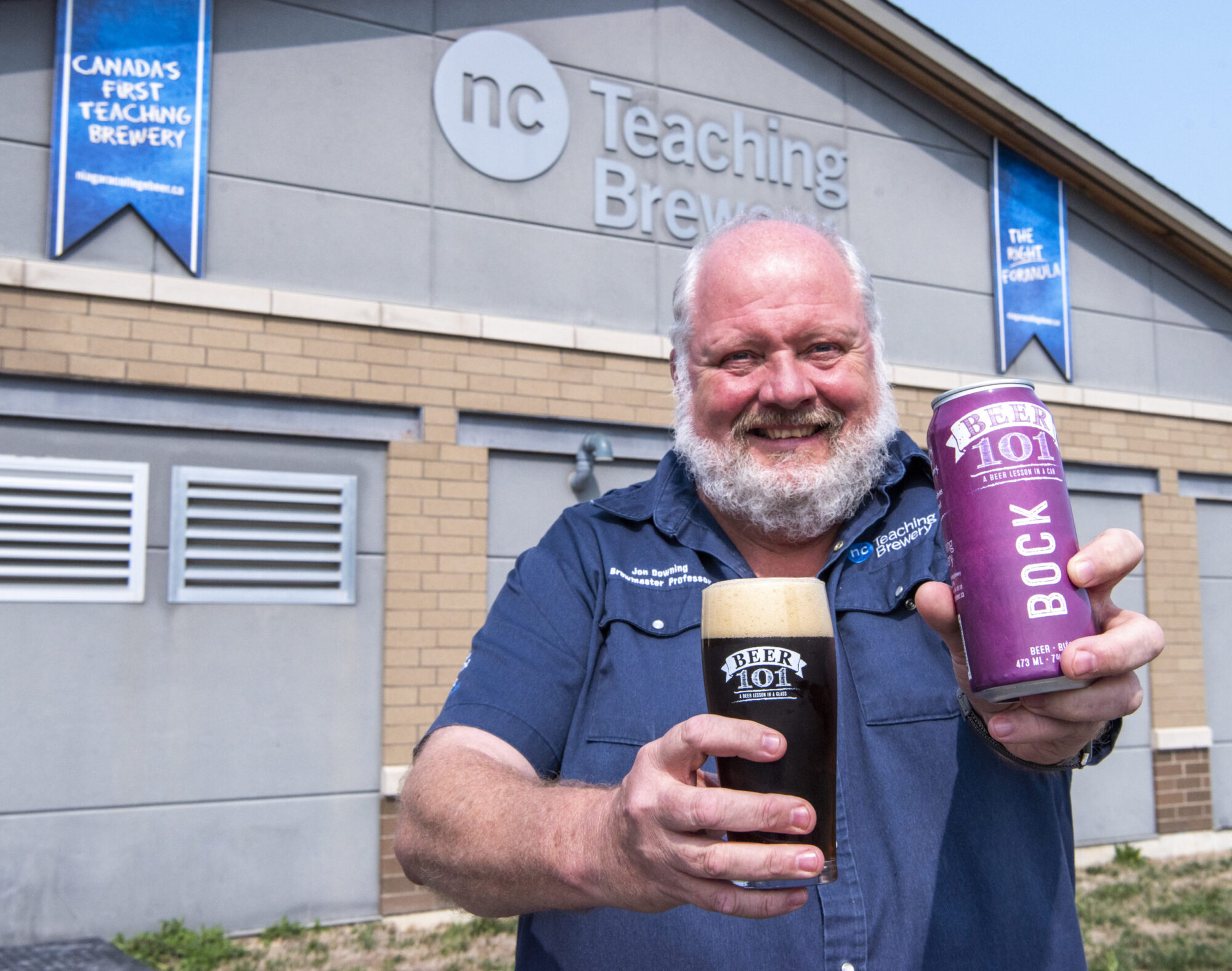 College Brewmaster Jon Downing holds up a can of award-winning Beer 101 Bock at the Niagara College Teaching Brewery.