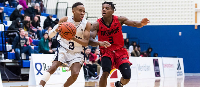 A Fanshawe player tries to take the ball from a Niagara Knights player in a basketball game