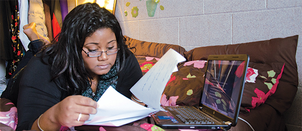 Student studying on couch