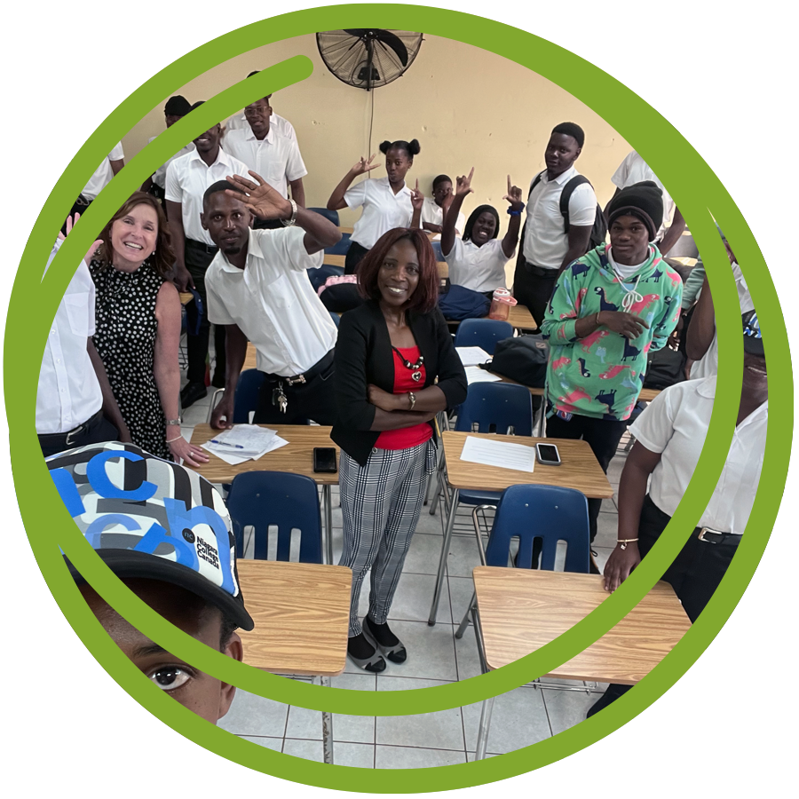 Students in an African partnership classroom cheering and wearing NC gear