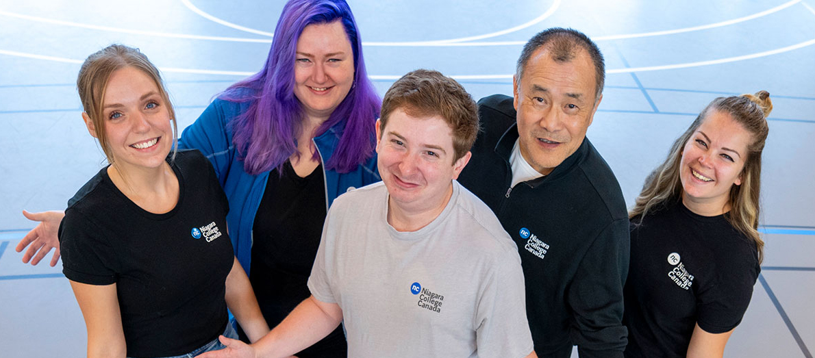 Five Recruitment Team members posing welcomingly