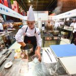 Team Member Daniella Germond gets to work in the Culinary Olympics kitchen.