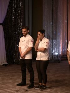 A man and woman wearing chef uniforms.