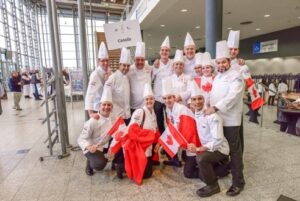The team strikes a patriotic pose on opening ceremony day.